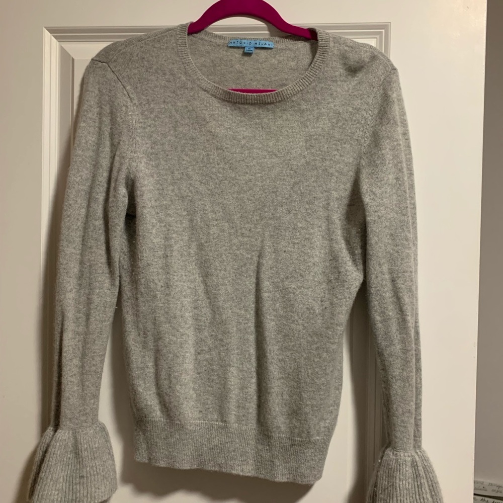 Adorable sweater with detailing on the sleeves